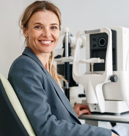 Eye doctor in Chesapeake using an eye checkup machine to examine a patient's eyes.