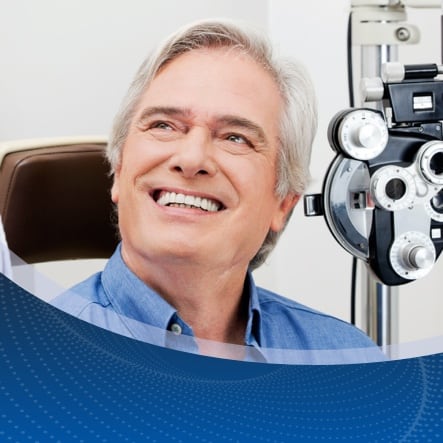 A male patient smiles during a friendly consultation with an ophthalmologist during Glaucoma checkup